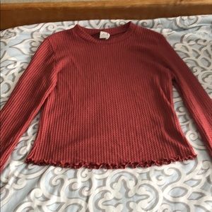 A pink long sleeve shirt